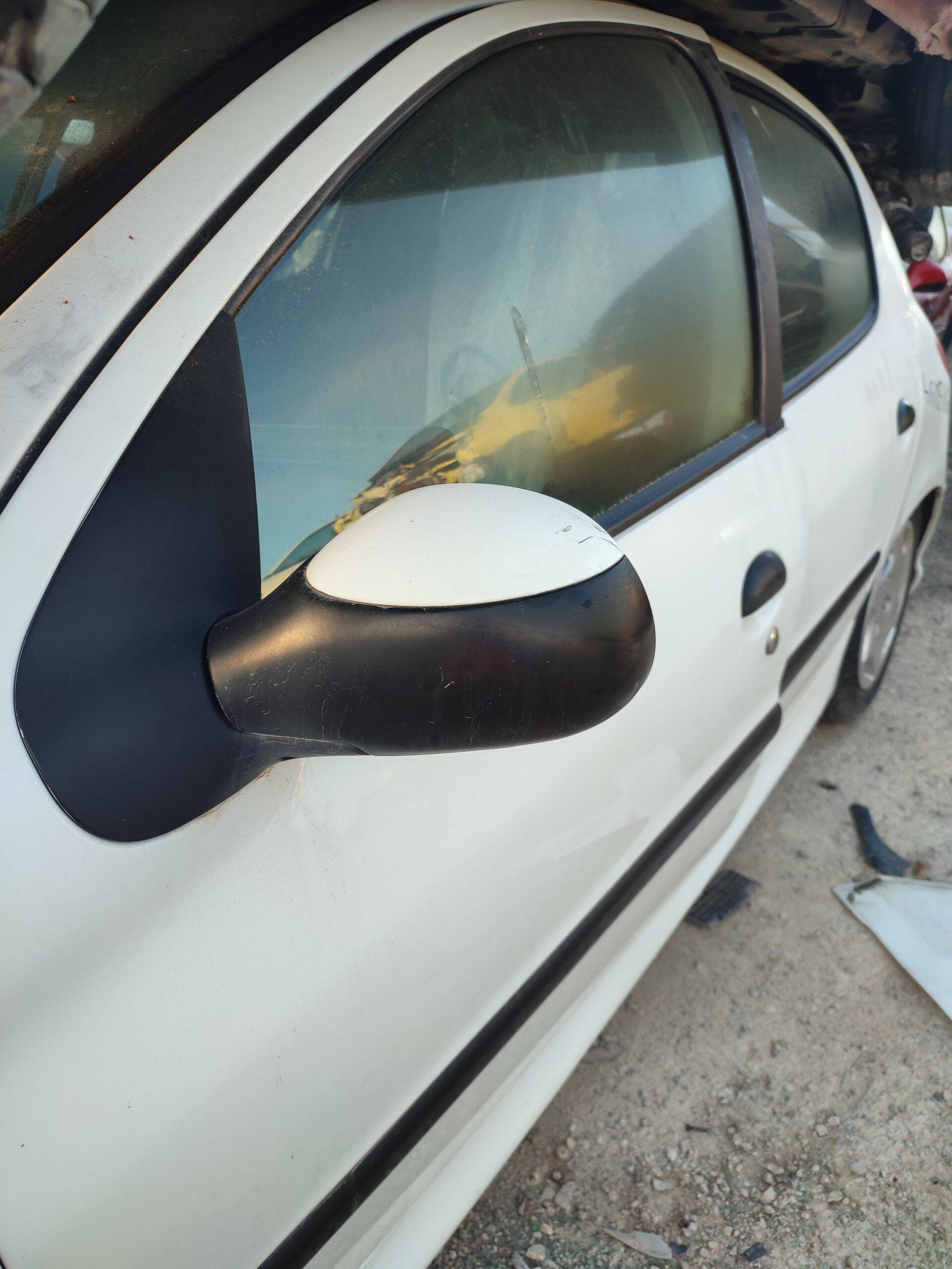 Retrovisor izq peugeot 206